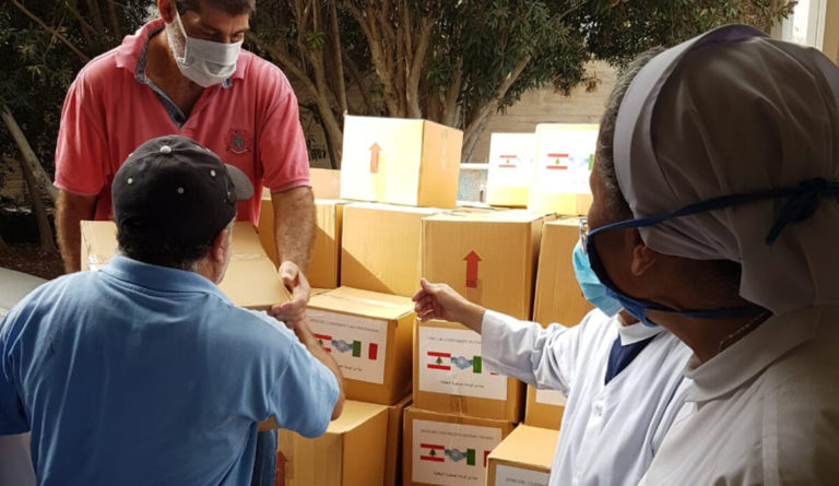 UNIFIL:  Italian peacekeepers distribute food packages to needy families